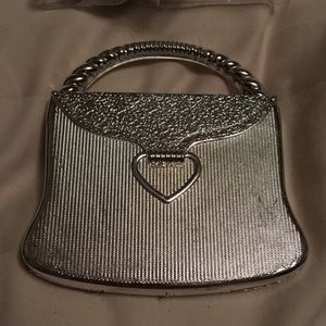 Pocket mirror in shape of a purse .
